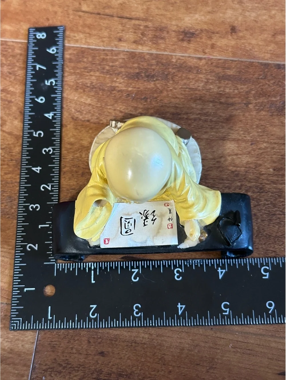 Vintage Yellow Monk Figurine with Scroll and Black Stand